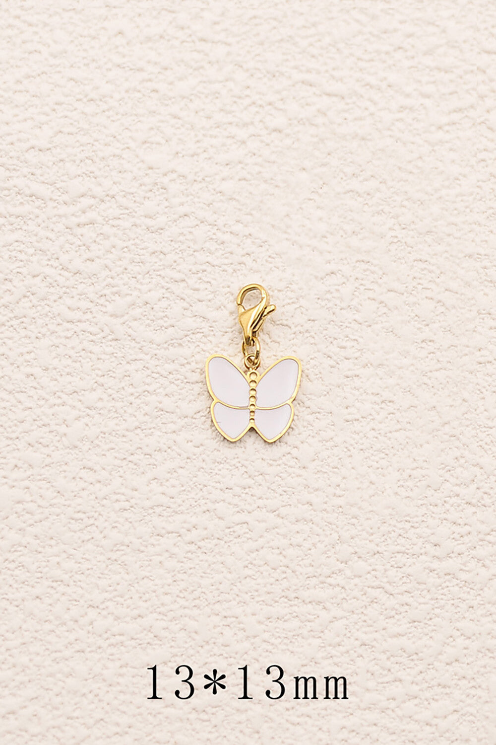 Le charm "Papillon en émail"